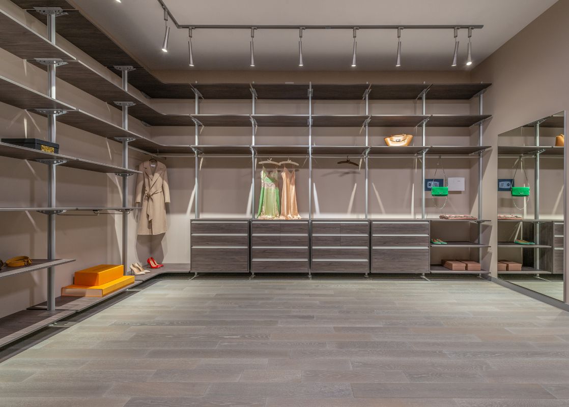 Glass cabinet display storage in custom walk-in closet